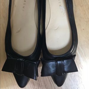 Black Ivanka Trump flats with bow.